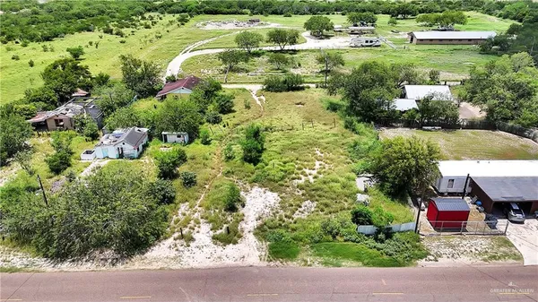 a view of a house with a yard and garden