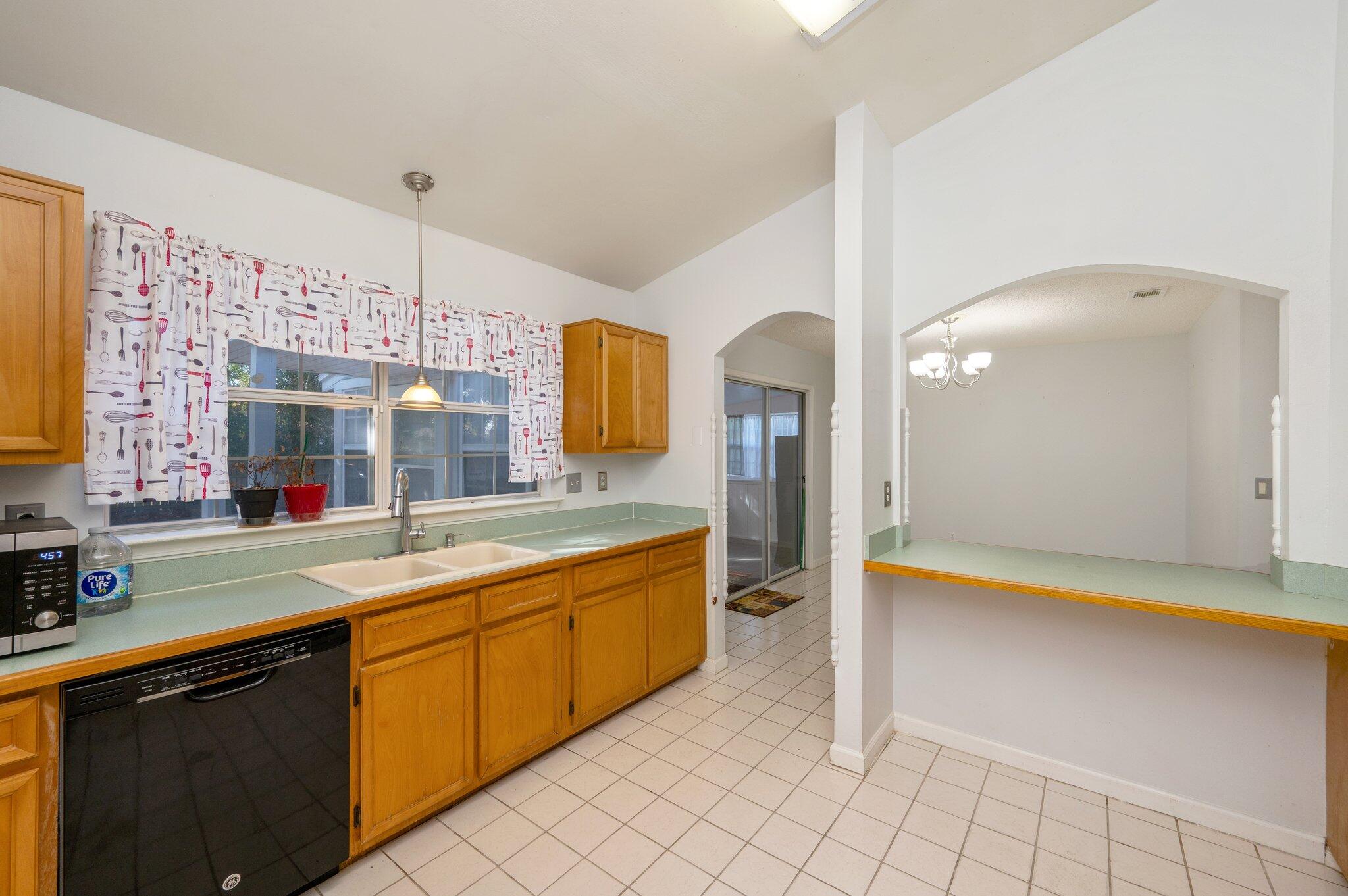 9 Holly Road Crestview, FL 32539 - Photo 11 of 32 a large kitchen with a counter space a sink and cabinets