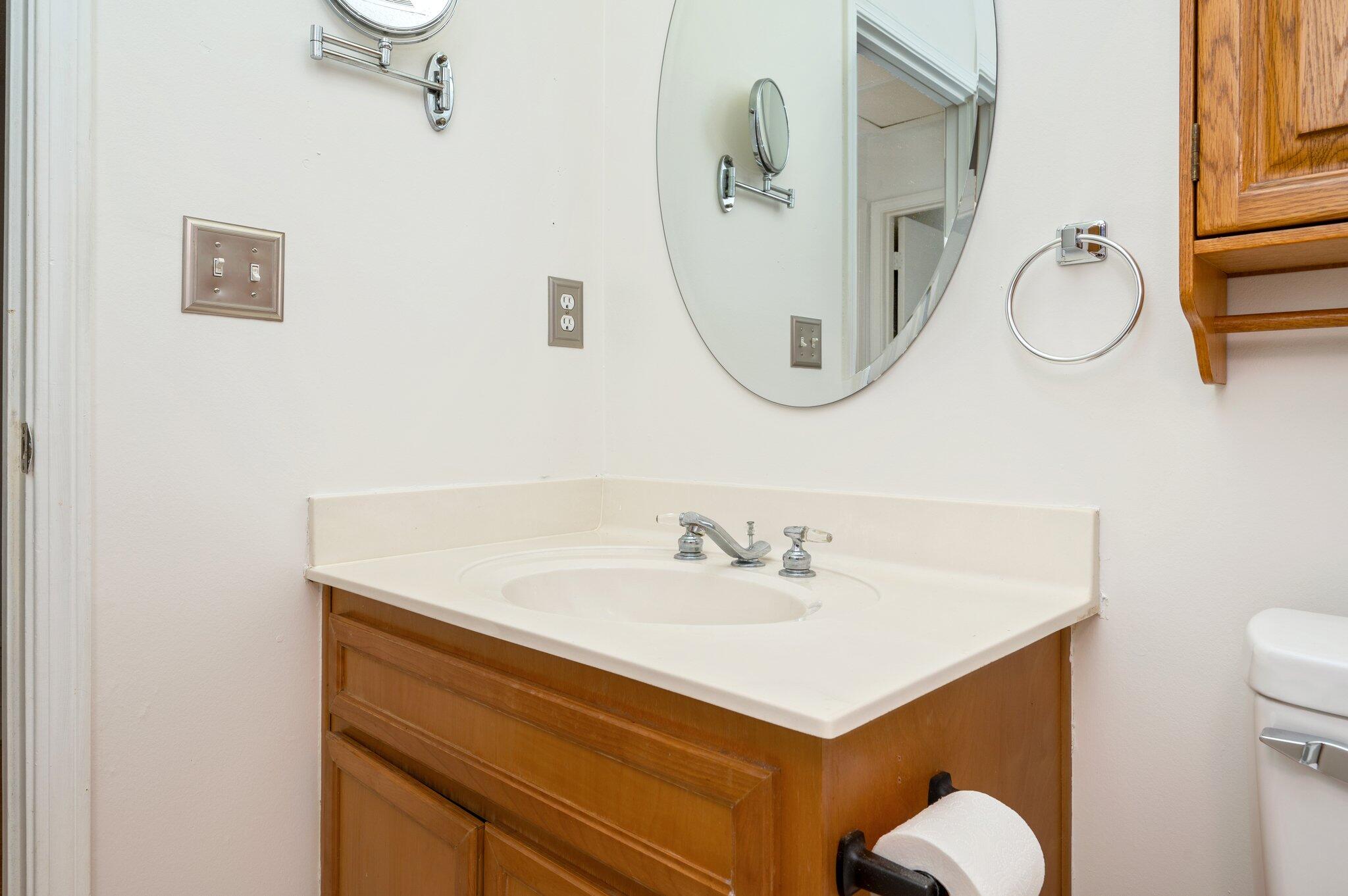 9 Holly Road Crestview, FL 32539 - Photo 22 of 32 a bathroom with a sink and mirror