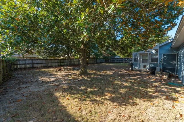 a backyard of a house with lots of green space