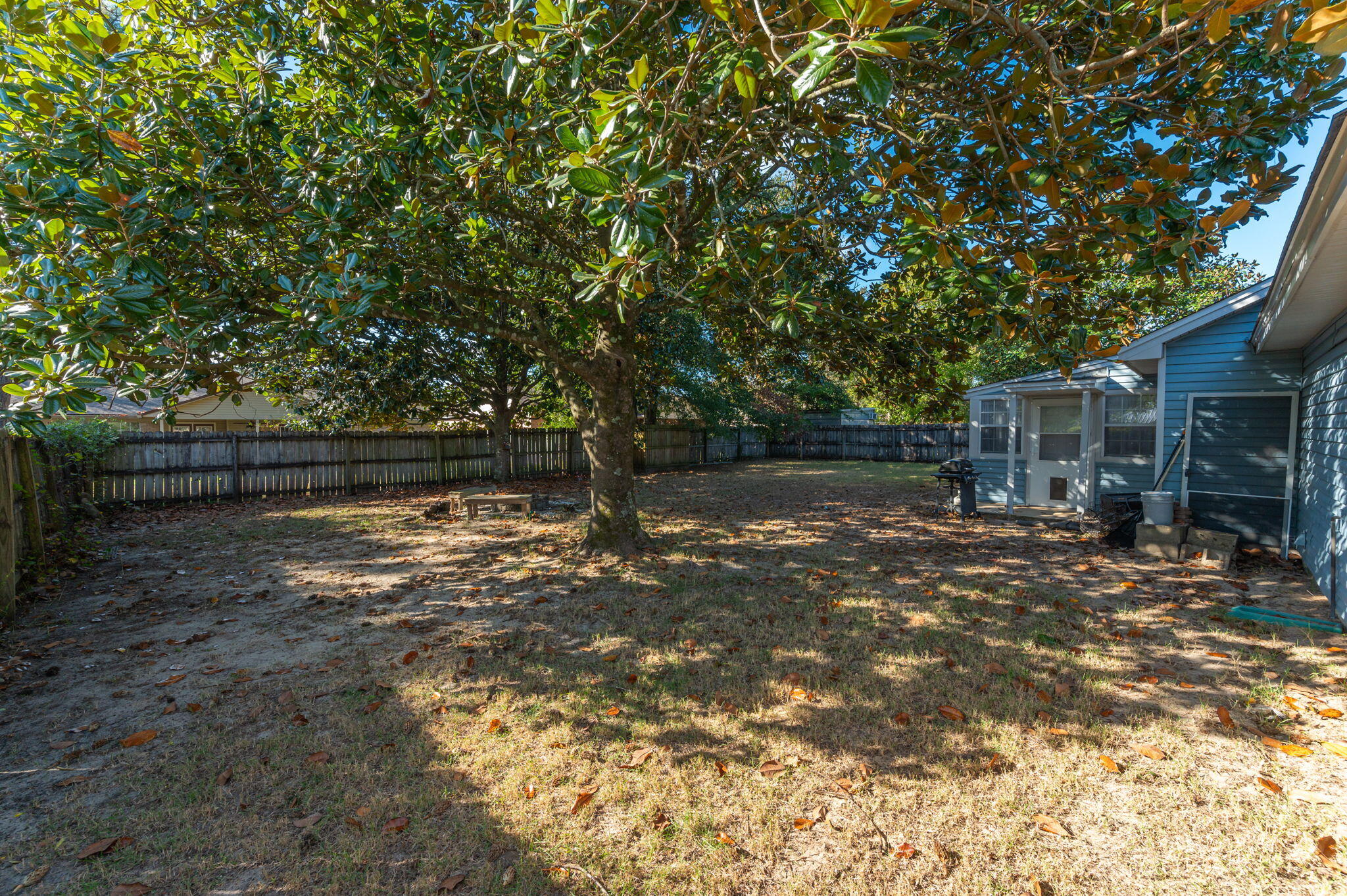9 Holly Road Crestview, FL 32539 - Photo 27 of 32 a backyard of a house with lots of green space