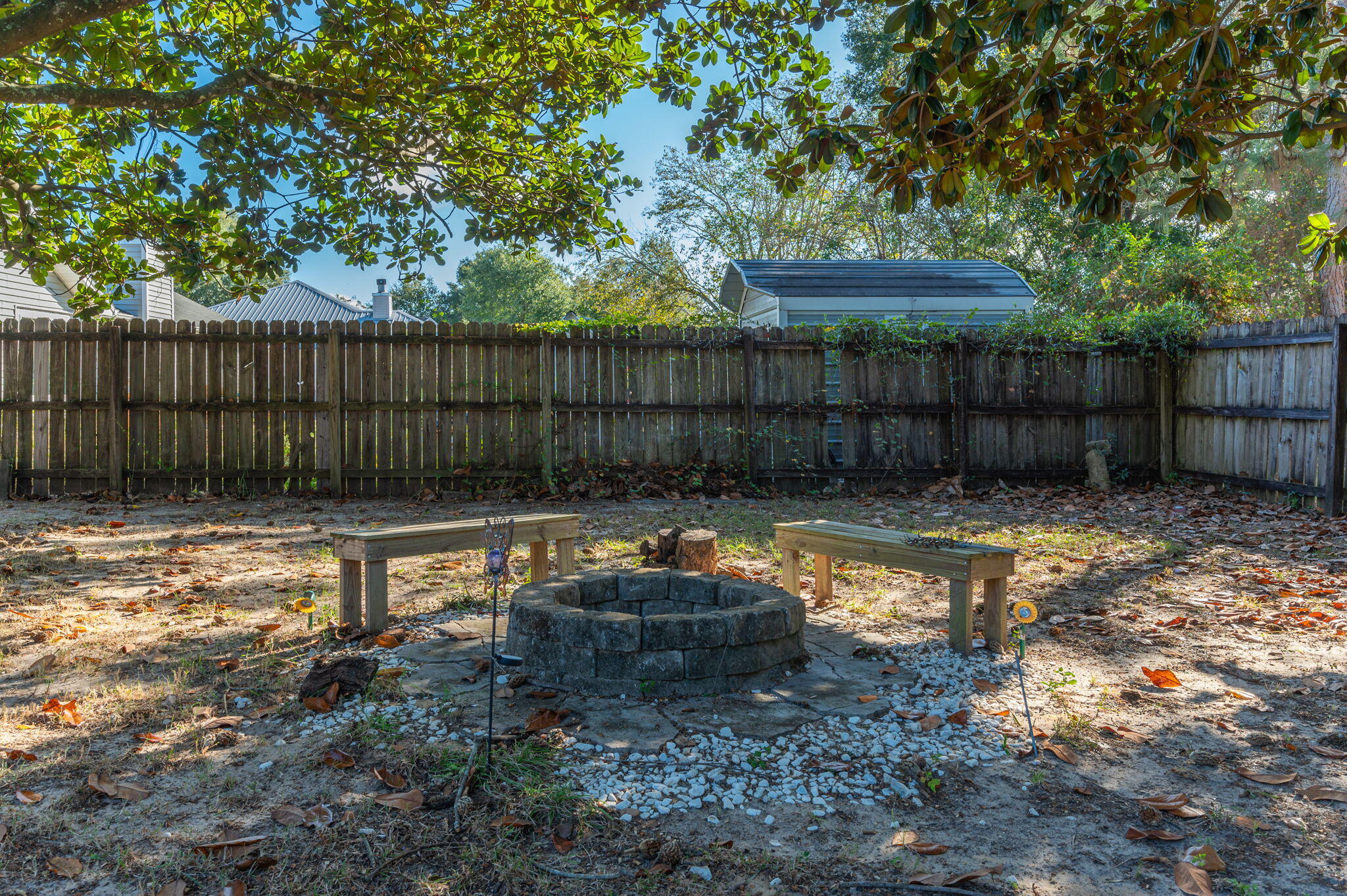 9 Holly Road Crestview, FL 32539 - Photo 29 of 32 a backyard of a house with lots of green space