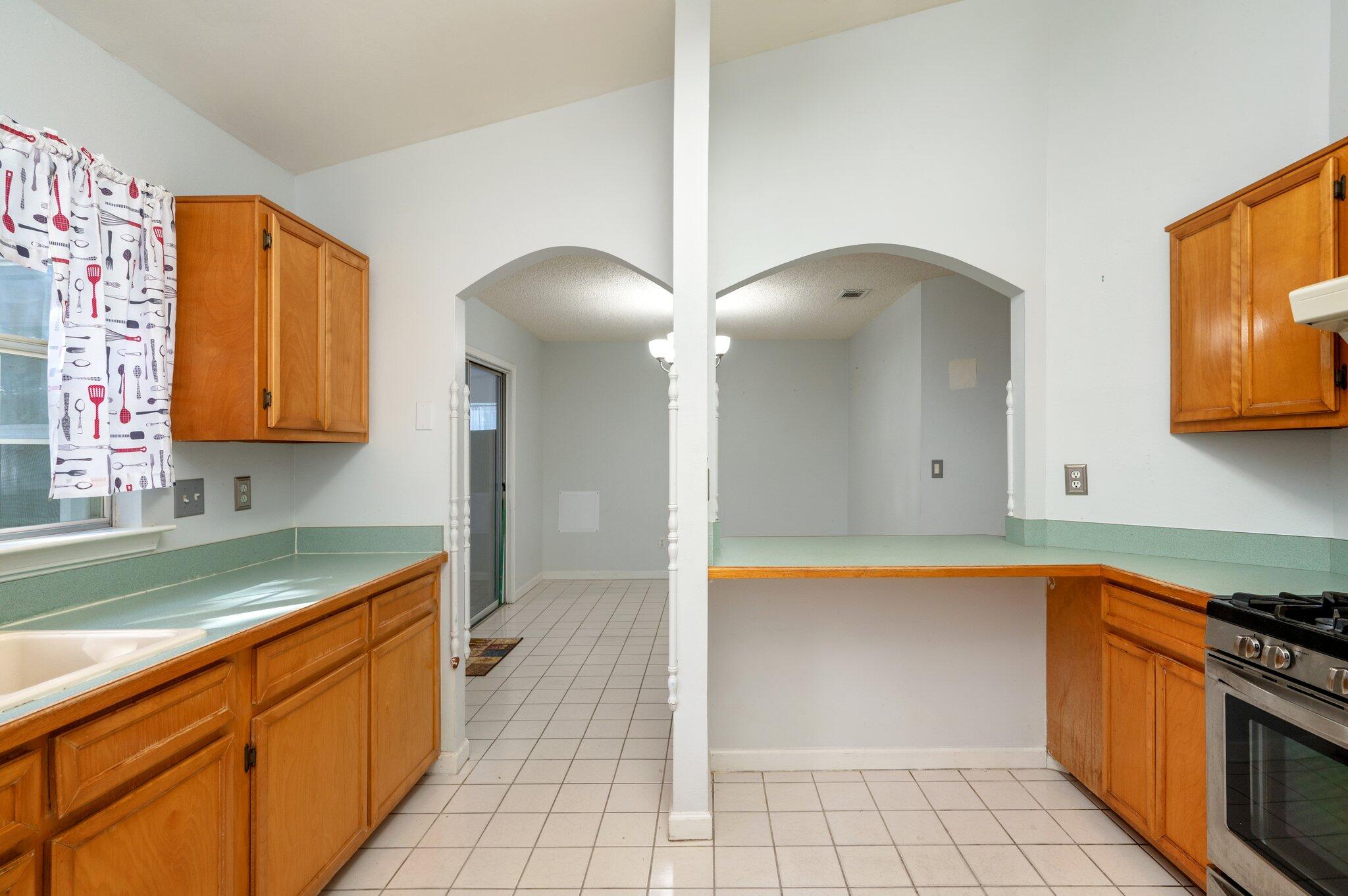 9 Holly Road Crestview, FL 32539 - Photo 10 of 32 a kitchen with stainless steel appliances granite countertop a sink and cabinets