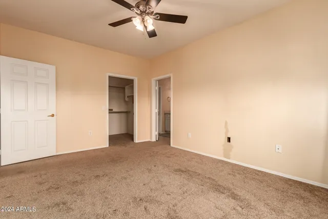 a view of an empty room with a bathroom