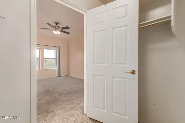 a view of an empty room with a window