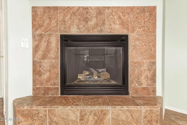 a view of fireplace with wooden floor