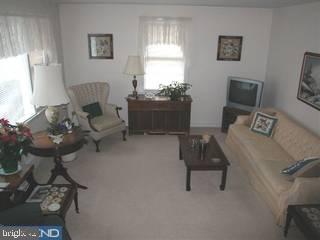 432 Barker Road Springfield, PA 19064 - Photo 2 of 6 a living room with furniture and a flat screen tv