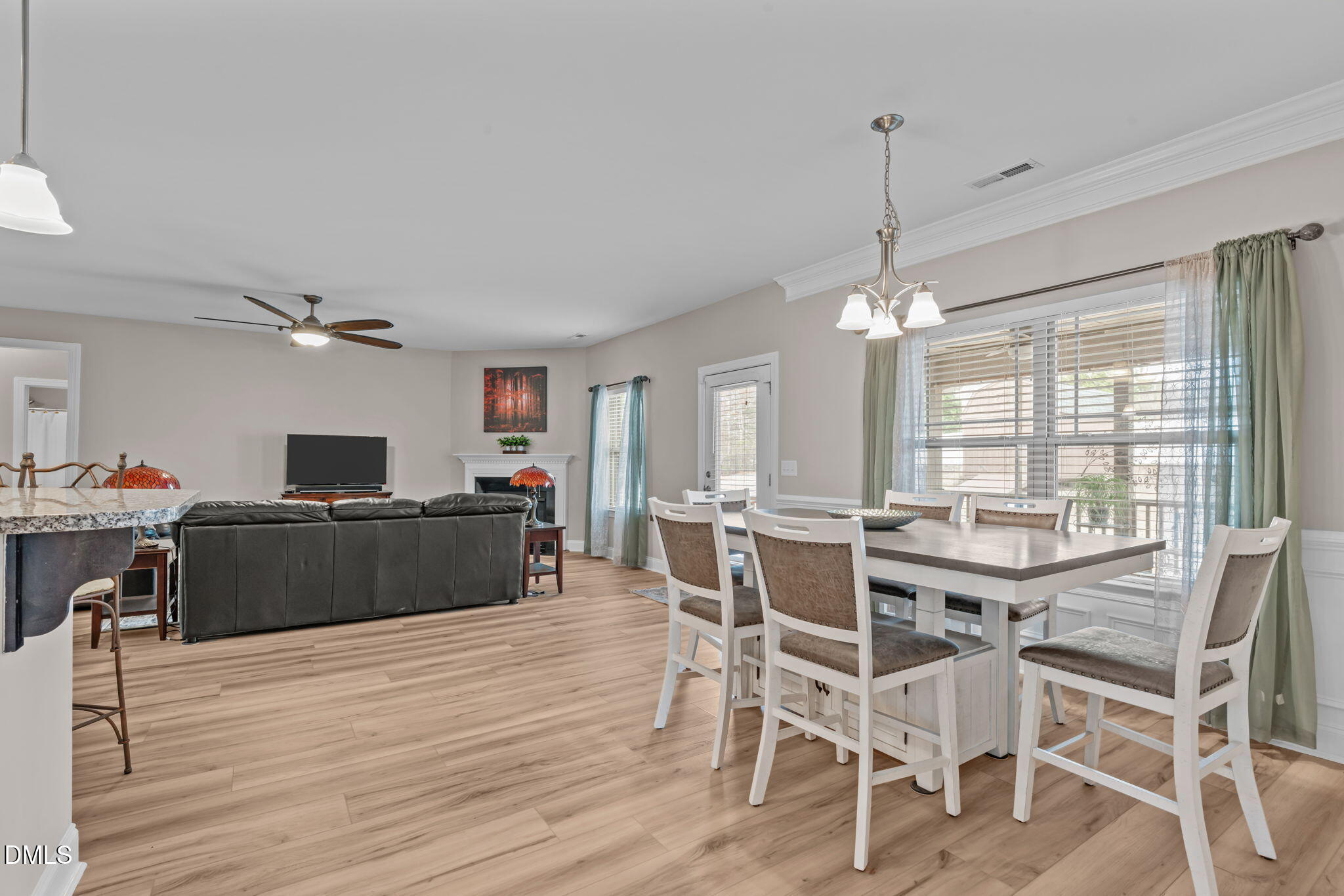 90 Cypress Ridge Way. Willow Spring, NC 27592 - Photo 51 of 52 a view of a dining room with furniture window and wooden floor