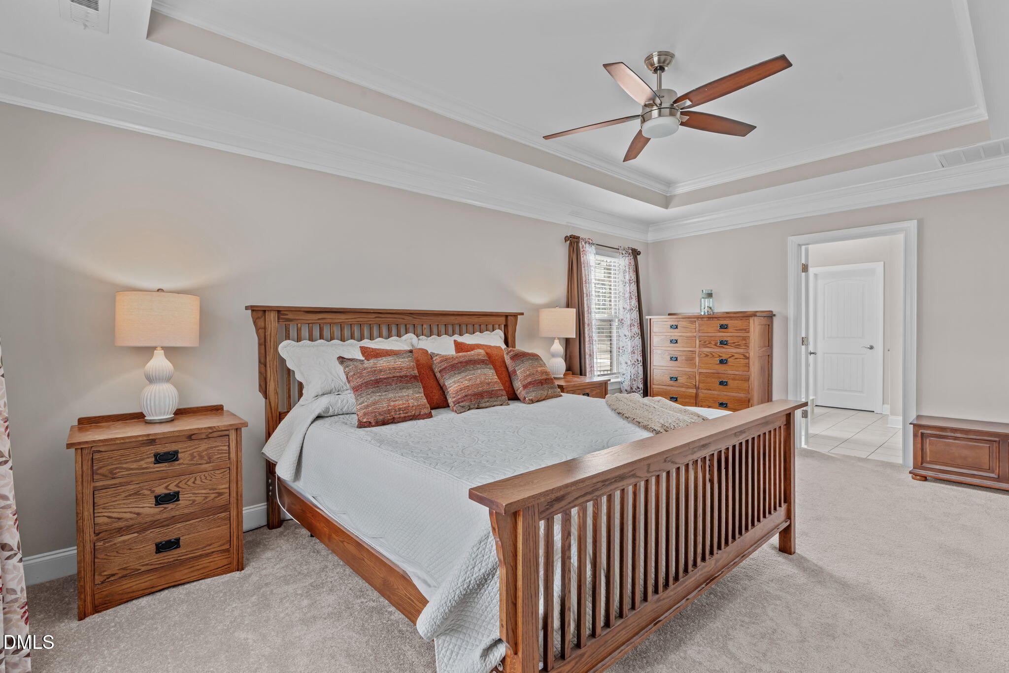 90 Cypress Ridge Way. Willow Spring, NC 27592 - Photo 12 of 52 a bedroom with a bed a bed and a chandelier