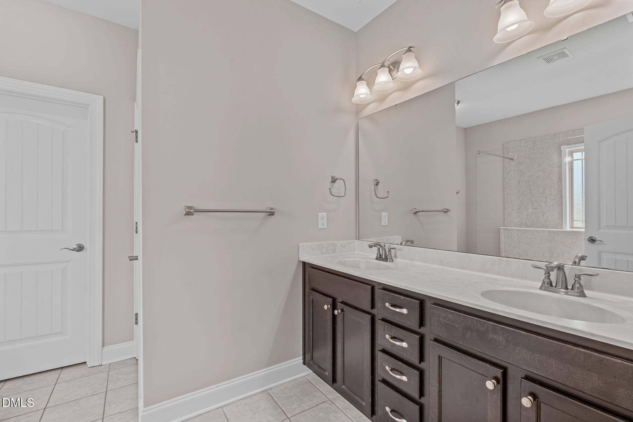 90 Cypress Ridge Way. Willow Spring, NC 27592 - Photo 14 of 52 a bathroom with a granite countertop sink a light fixture and a mirror