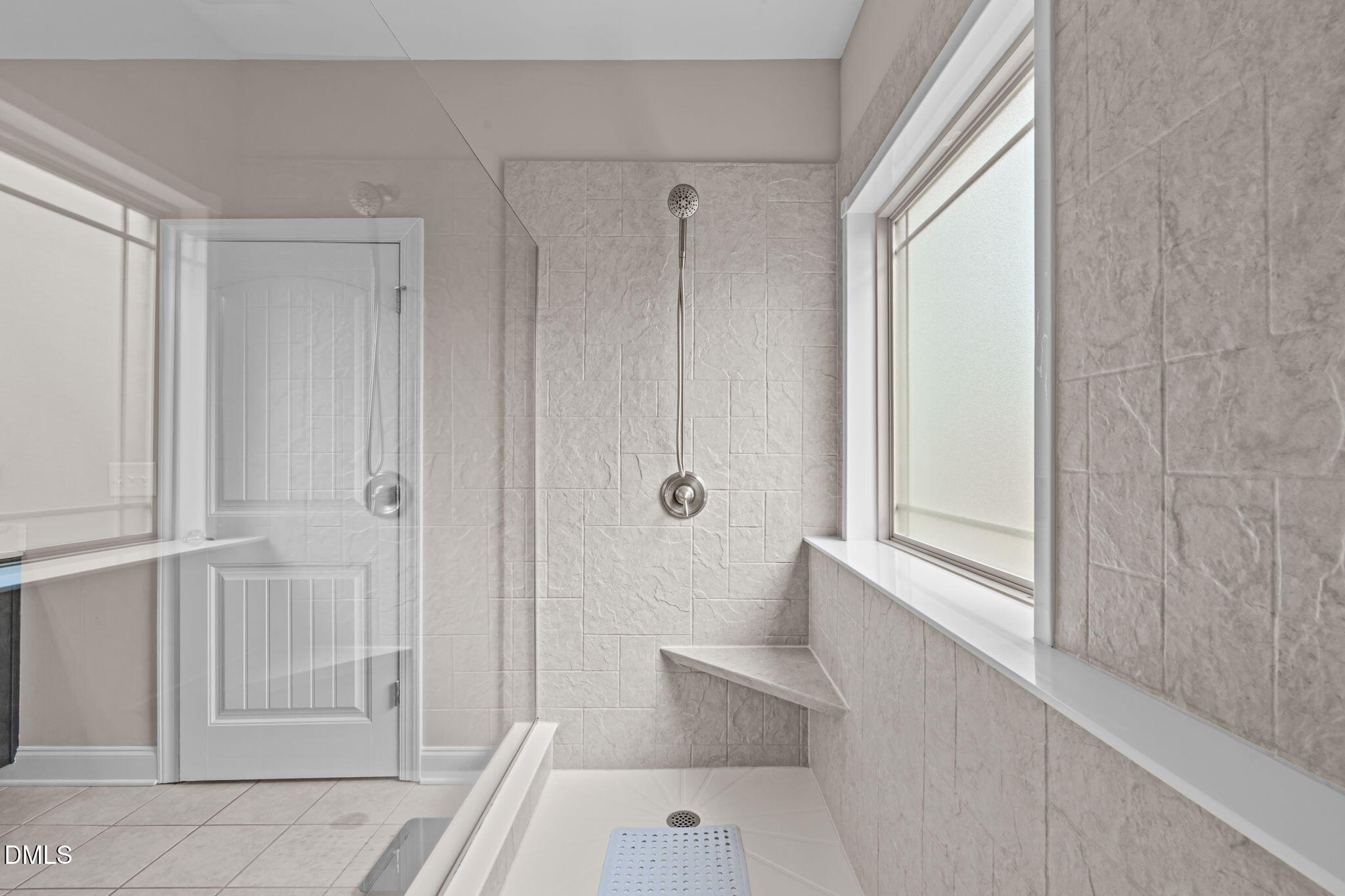 90 Cypress Ridge Way. Willow Spring, NC 27592 - Photo 16 of 52 a bathroom with a tub and shower