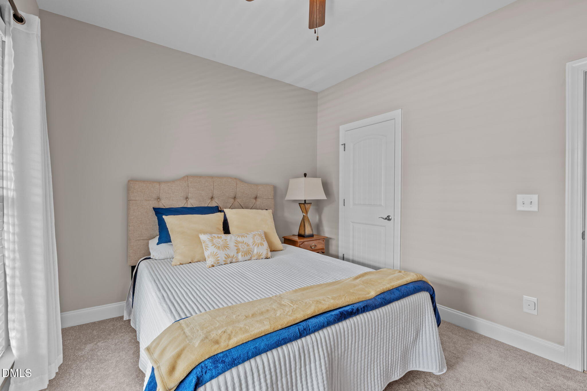 90 Cypress Ridge Way. Willow Spring, NC 27592 - Photo 19 of 52 a bedroom with a bed and a window