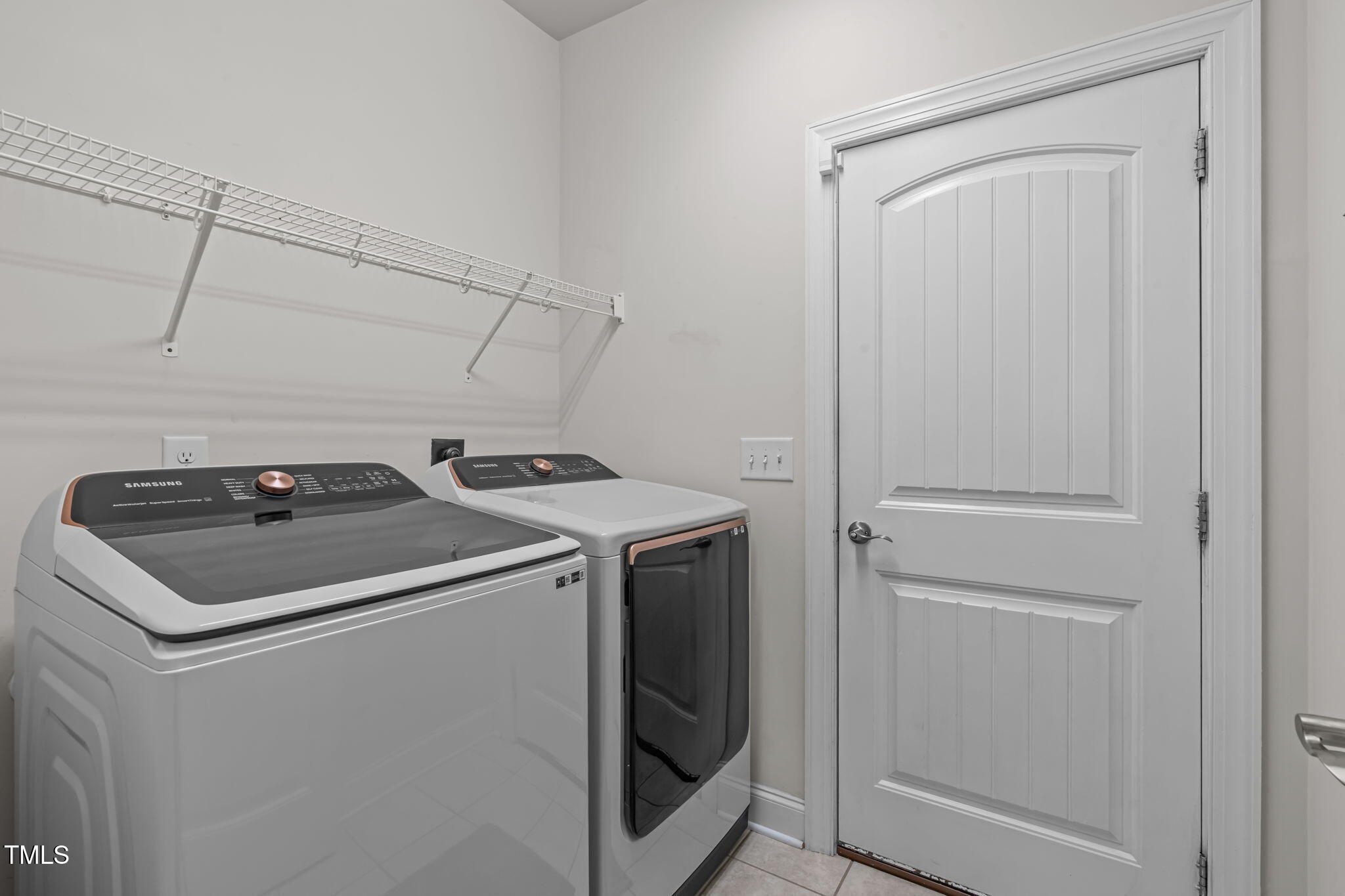 90 Cypress Ridge Way. Willow Spring, NC 27592 - Photo 23 of 52 a utility room with dryer and washer