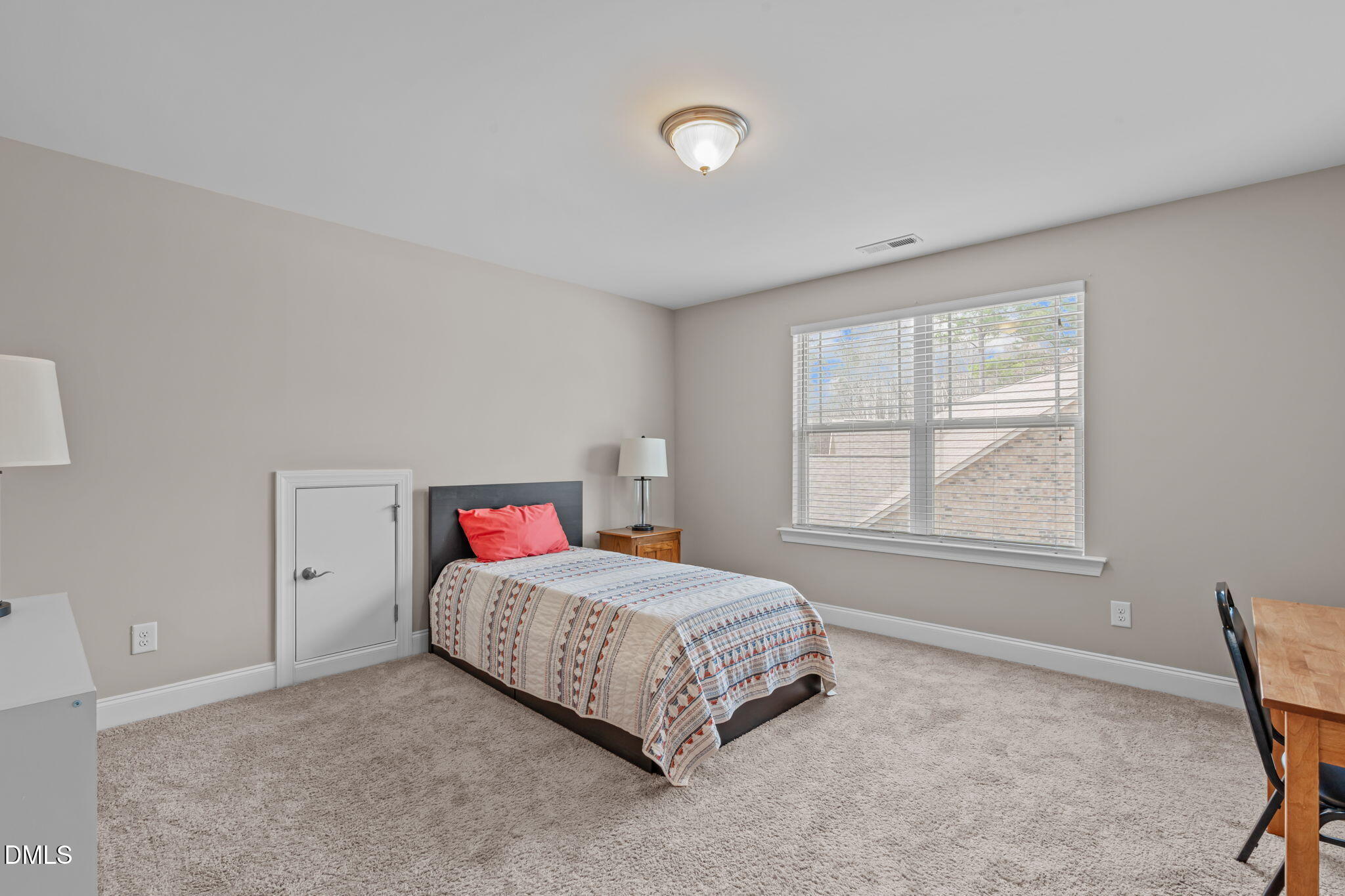 90 Cypress Ridge Way. Willow Spring, NC 27592 - Photo 24 of 52 a living room with a bed and a table