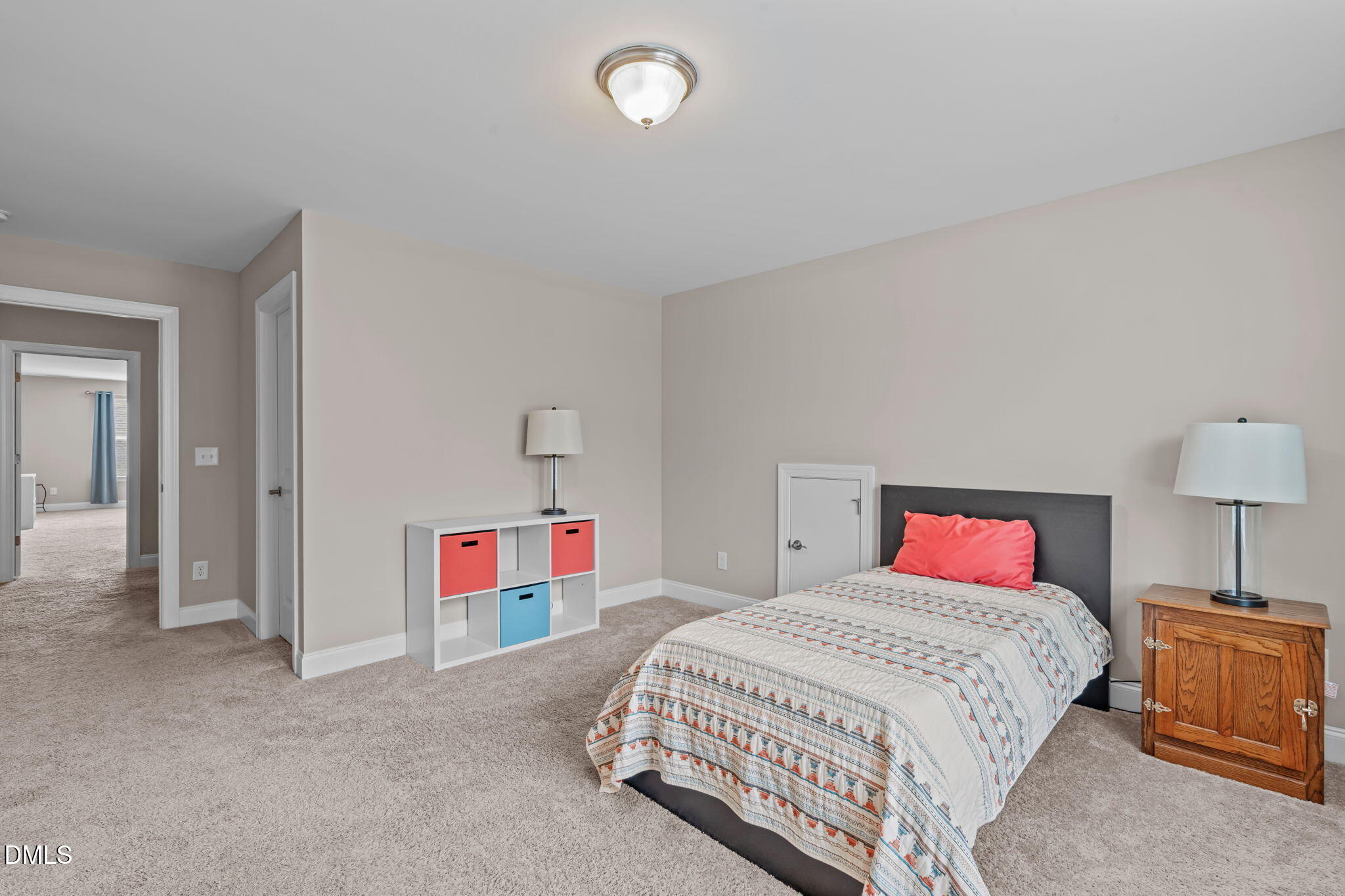 90 Cypress Ridge Way. Willow Spring, NC 27592 - Photo 25 of 52 a bedroom with a bed and a chandelier