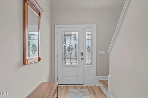a view of a living room with a wooden floor