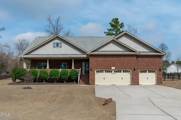 front view of a house with a yard