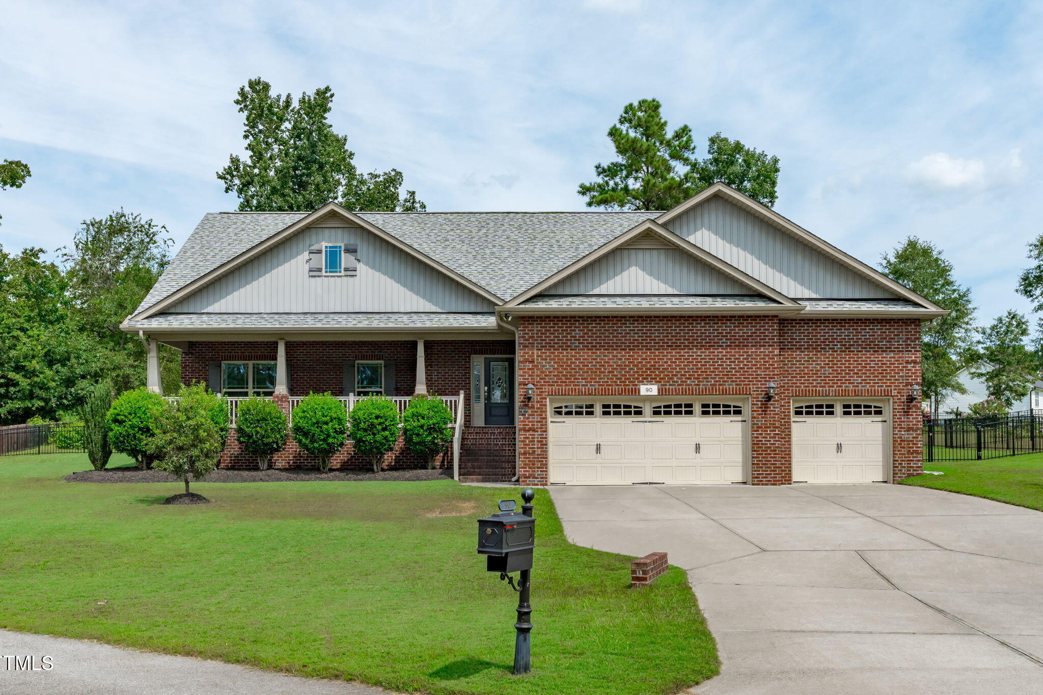90 Cypress Ridge Way. Willow Spring, NC 27592 - Photo 44 of 52 a front view of a house with a yard and garage