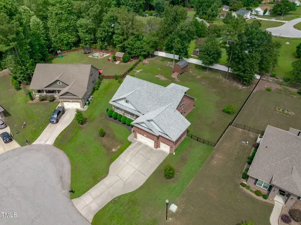 an aerial view of a house with a garden