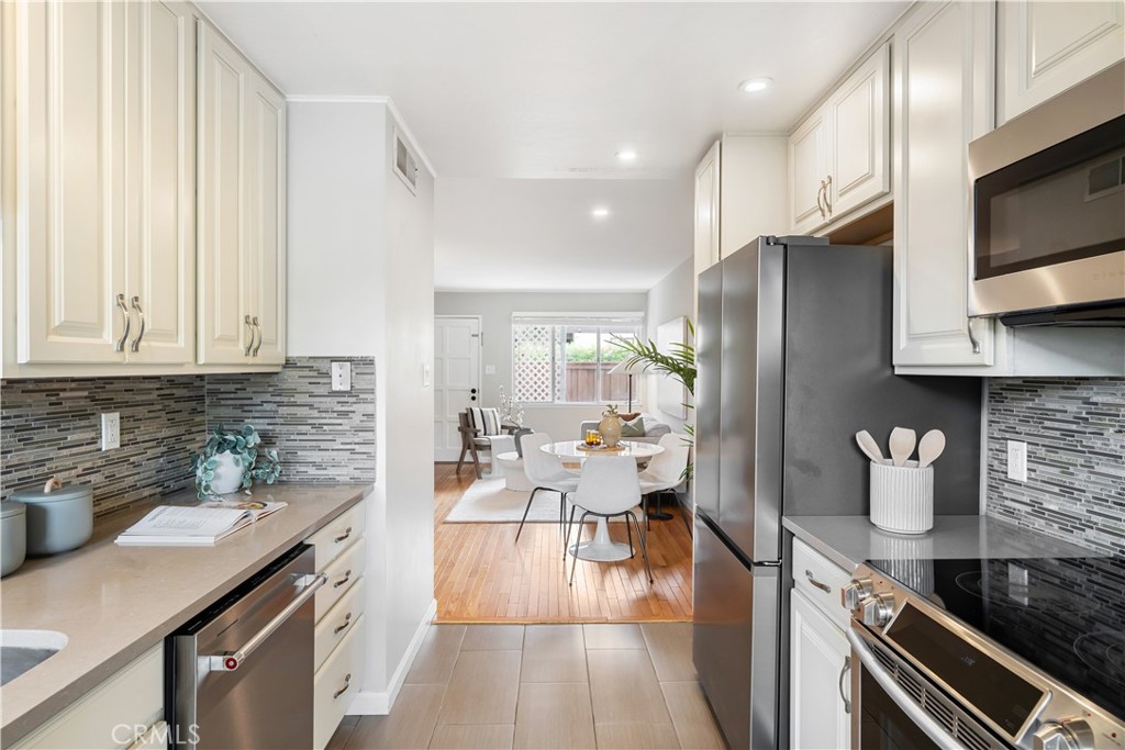 61 Pixley Avenue, Unit 3 Corte Madera, CA 94925 - Photo 7 of 17 a kitchen with a refrigerator and a stove top oven