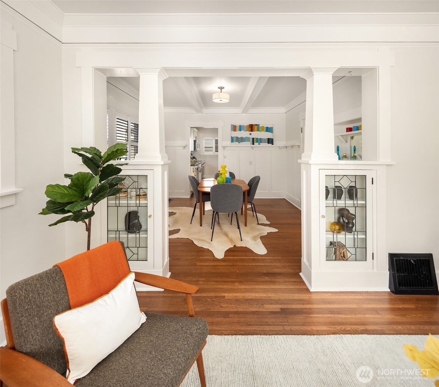 914 West Howe Street Seattle, WA 98119 - Photo 8 of 29 a living room with furniture wooden floor and a potted plant