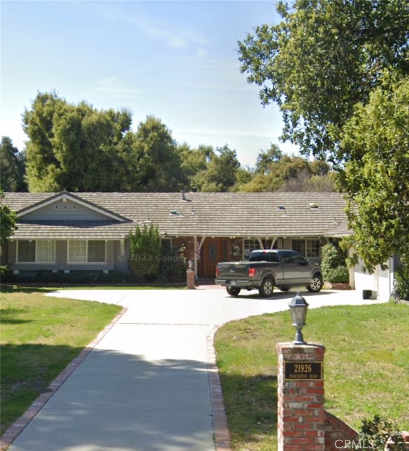 a swimming pool with outdoor seating and yard