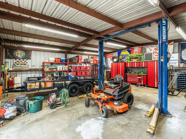 a view of a backyard with wooden fence