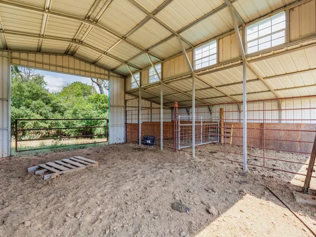 a view of a tables and chairs in a patio
