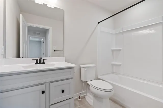 a bathroom with a sink a toilet and a bathtub