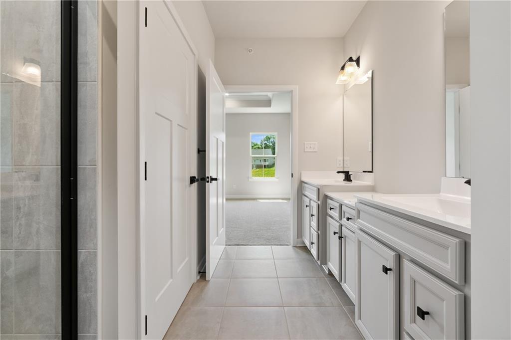 113 Olivia Drive Eighty Four, PA 15330 - Photo 21 of 29 a bathroom with a double vanity sink and mirror