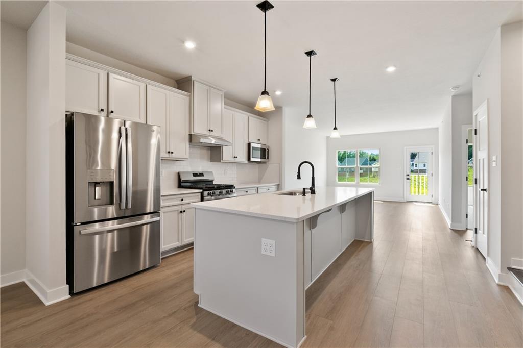 113 Olivia Drive Eighty Four, PA 15330 - Photo 6 of 29 a large kitchen with stainless steel appliances kitchen island granite countertop a refrigerator a oven a sink and a refrigerator