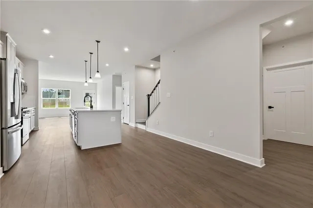 a view of kitchen with furniture and wooden floor