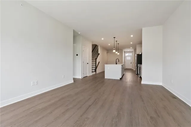 a view of a living room with wooden floor