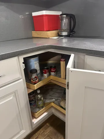 an empty room with a empty space and windows