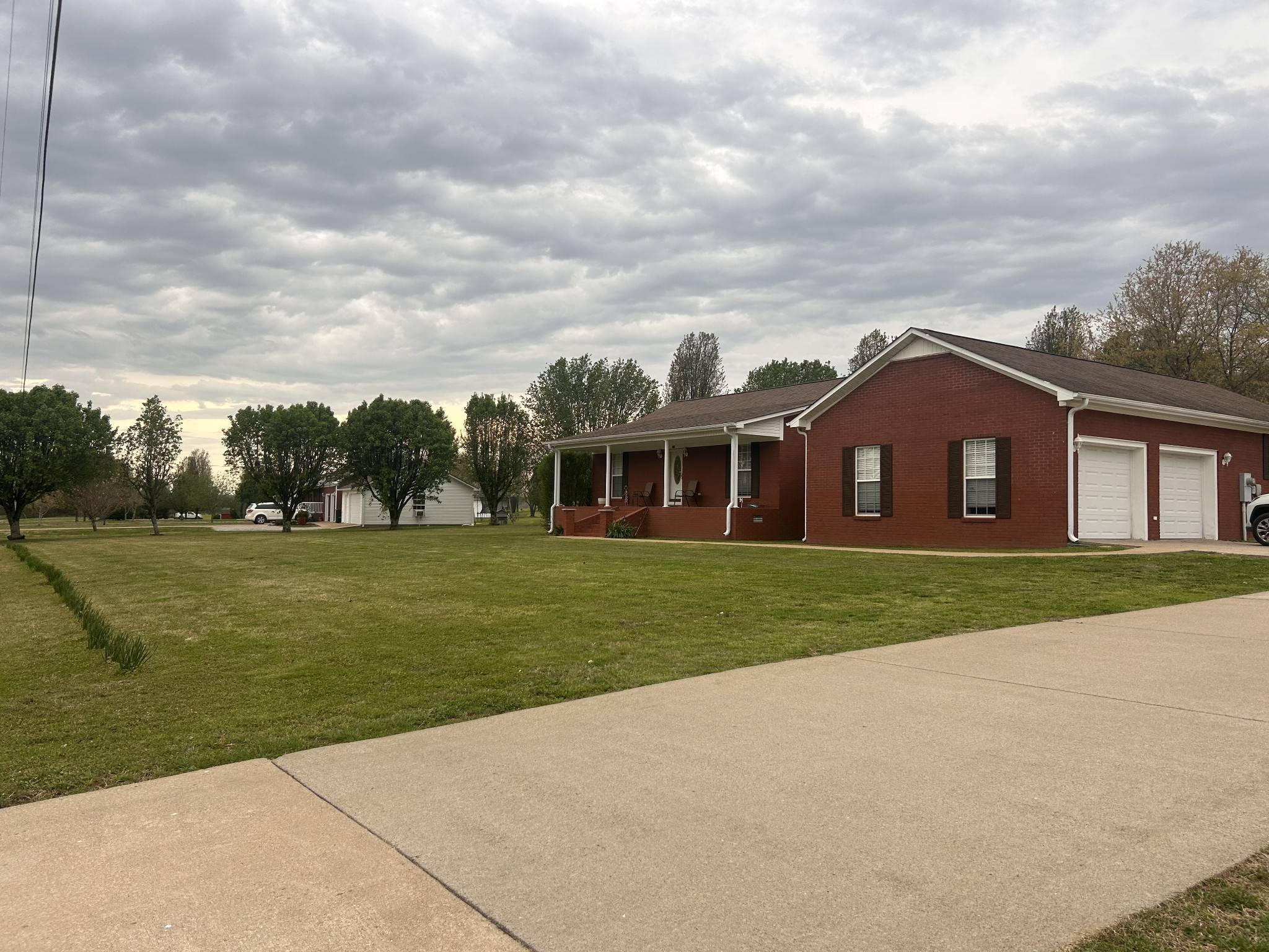 2200 Crescentview Road Pulaski, TN 38478 - Photo 3 of 72 a view of a big house with a big yard and potted plants