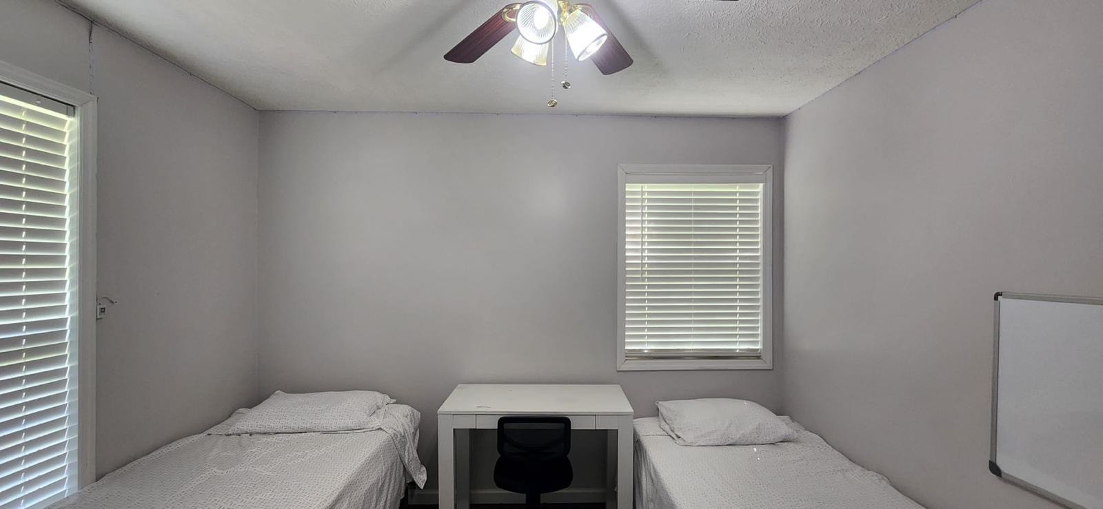 2200 Crescentview Road Pulaski, TN 38478 - Photo 49 of 72 a bathroom with a toilet a sink and a window