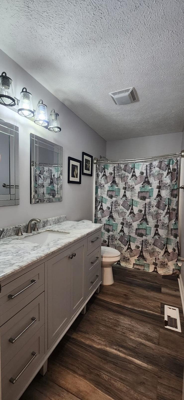 2200 Crescentview Road Pulaski, TN 38478 - Photo 54 of 72 a bathroom with a double vanity sink toilet and a mirror