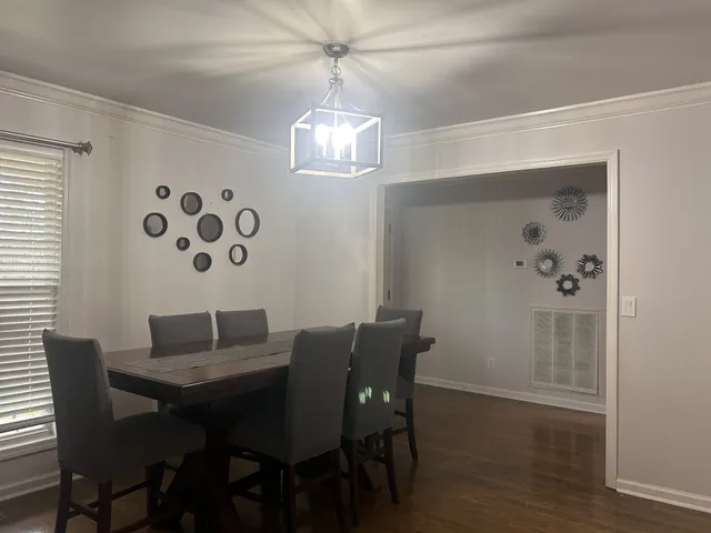 a kitchen with appliances cabinets and a counter top space