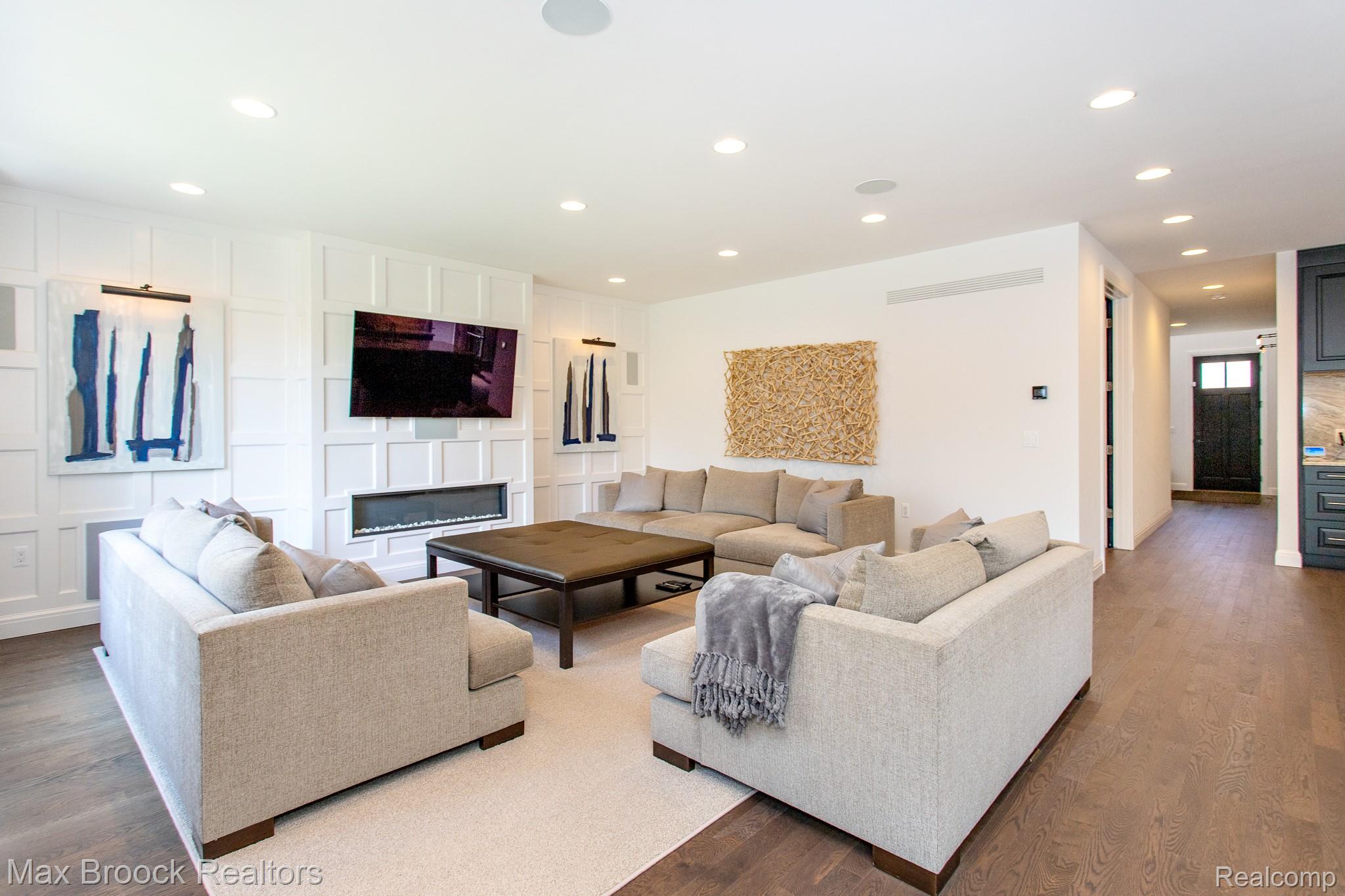 25925 York Road Royal Oak, MI 48067 - Photo 12 of 88 Living room with dark wood finished floors, recessed lighting, and a glass covered fireplace