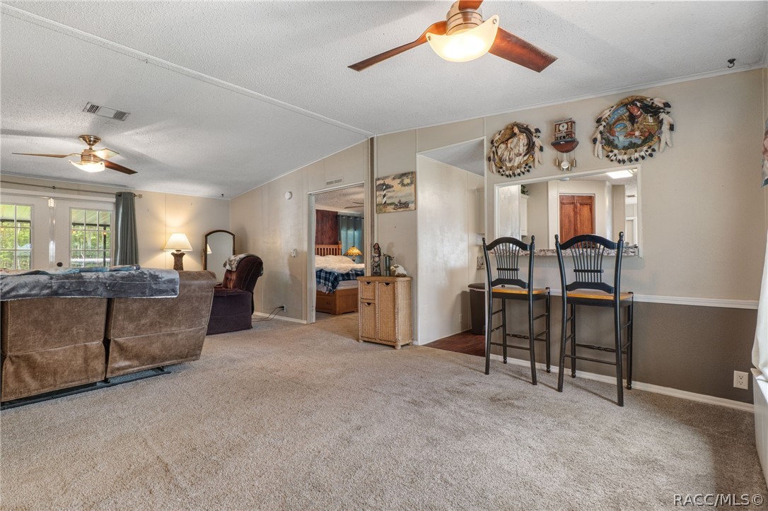 7927 West Cyprian Court Homosassa, FL 34448 - Photo 5 of 40 a living room with furniture and kitchen view