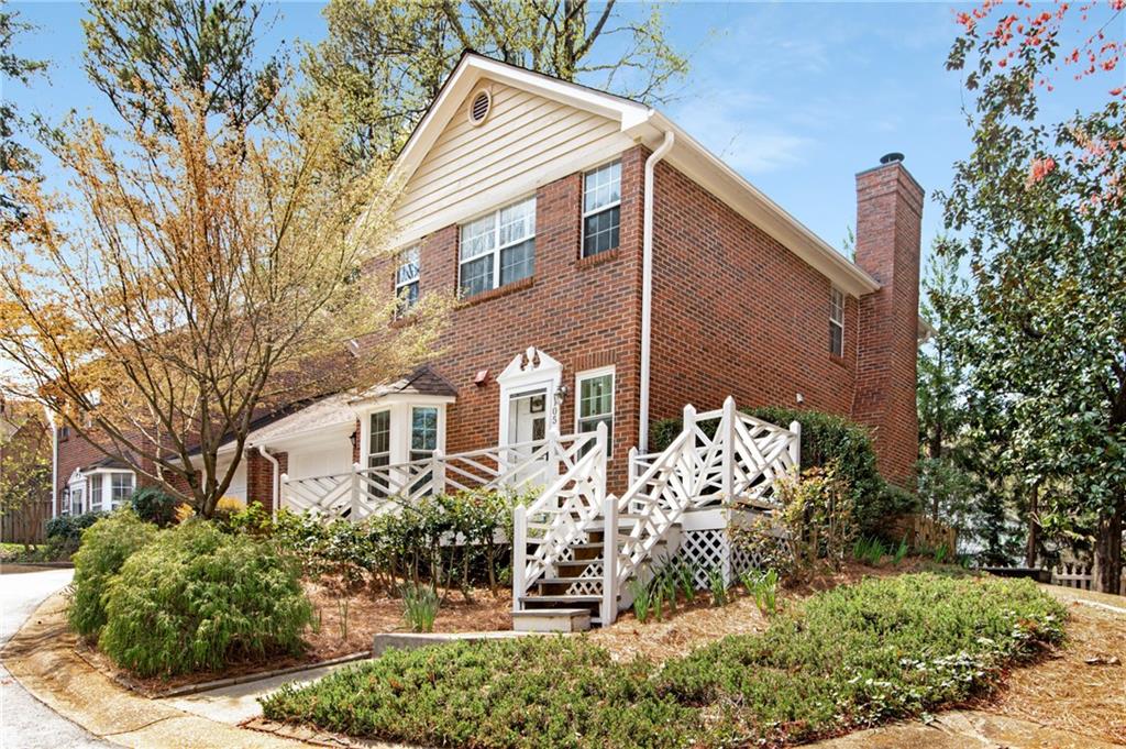 105 Swanton Hill Court, Unit 105 Decatur, GA 30030 - Photo 1 of 1 a front view of a house with a yard