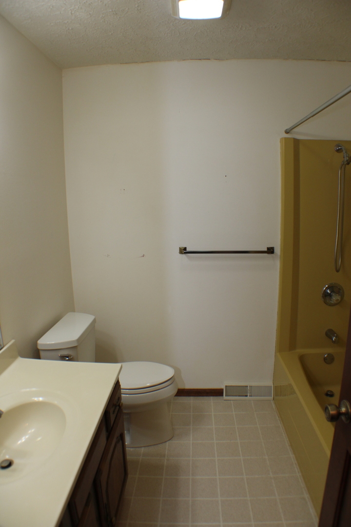 8 Apache Court Eldridge, IA 52748 - Photo 16 of 29 a bathroom with a sink and a toilet