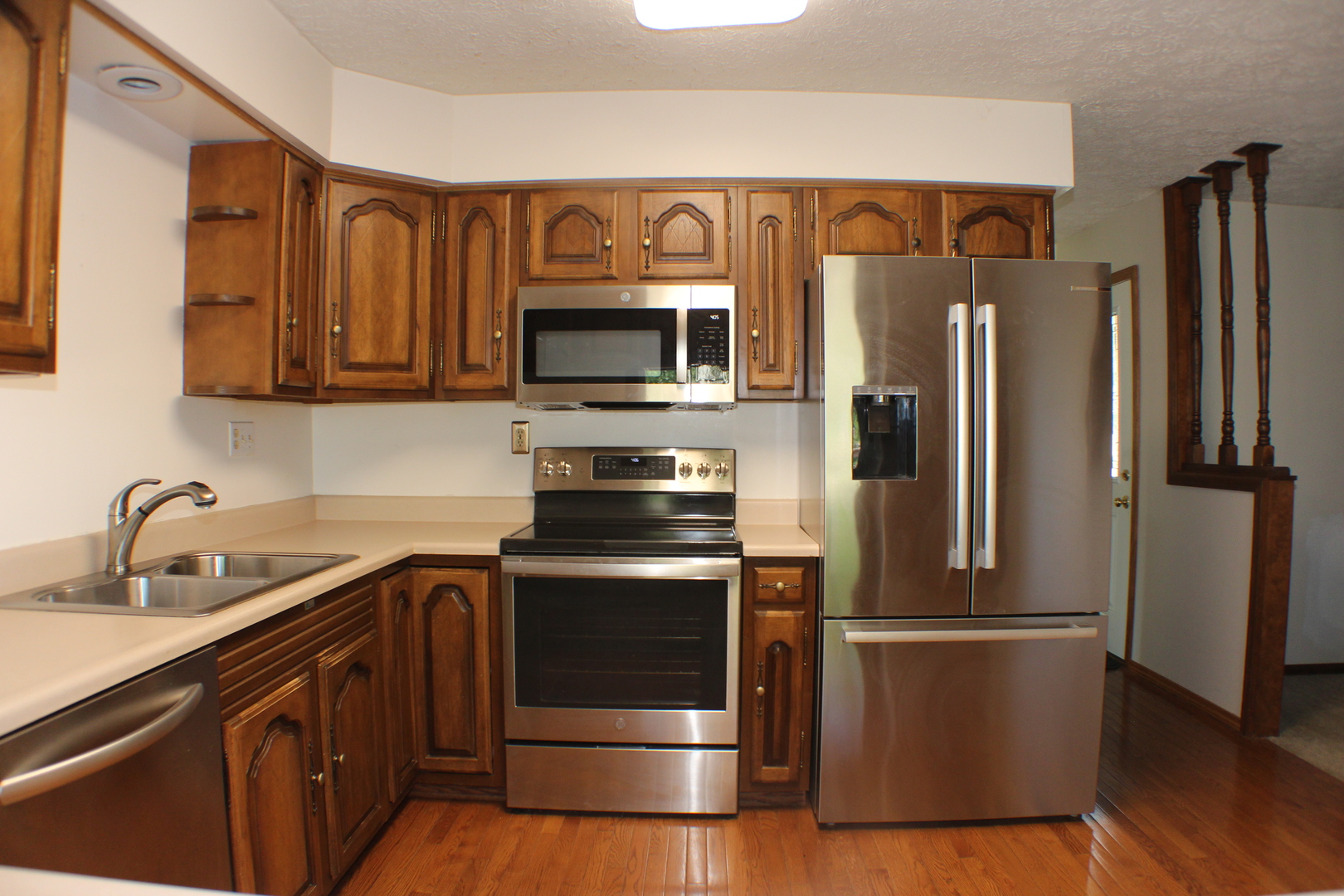 8 Apache Court Eldridge, IA 52748 - Photo 4 of 29 a kitchen with stainless steel appliances granite countertop a refrigerator stove and microwave