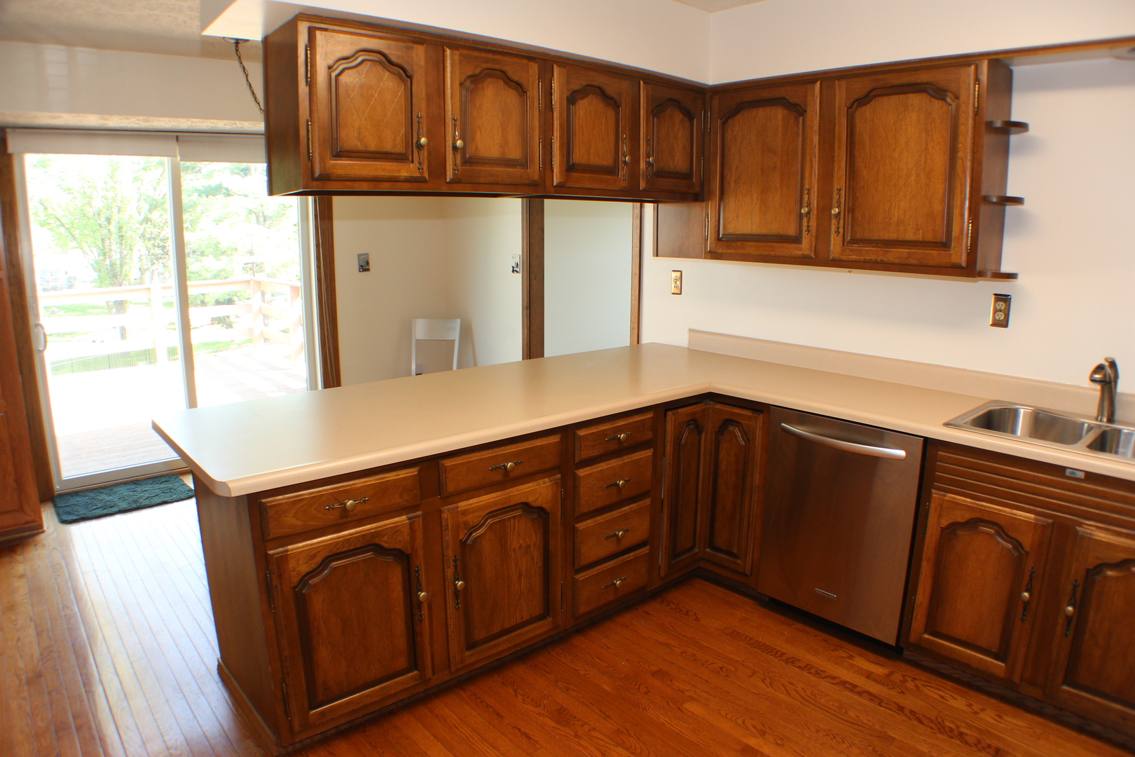 8 Apache Court Eldridge, IA 52748 - Photo 5 of 29 a kitchen with stainless steel appliances granite countertop cabinets and wooden floor
