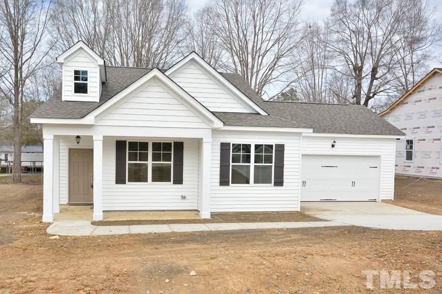 60 Mae Court Roxboro, NC 27573 - Photo 3 of 10 a view of a white house with a large space