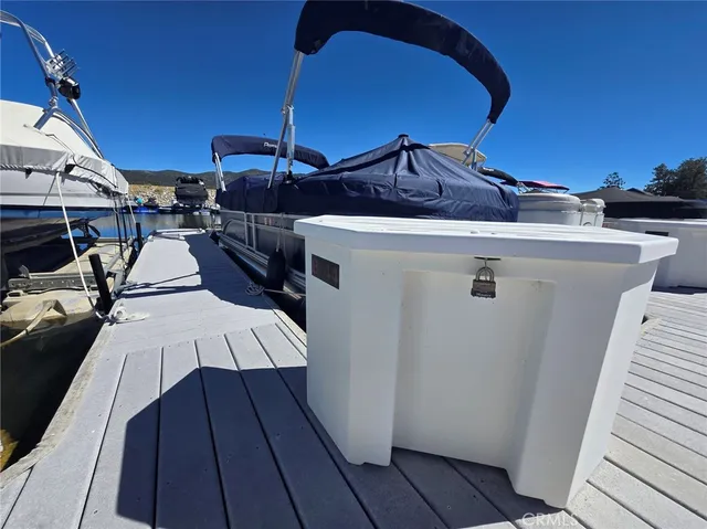 a roof deck with table and chairs
