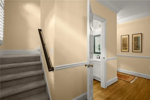 a spacious bedroom with a bed and a large window
