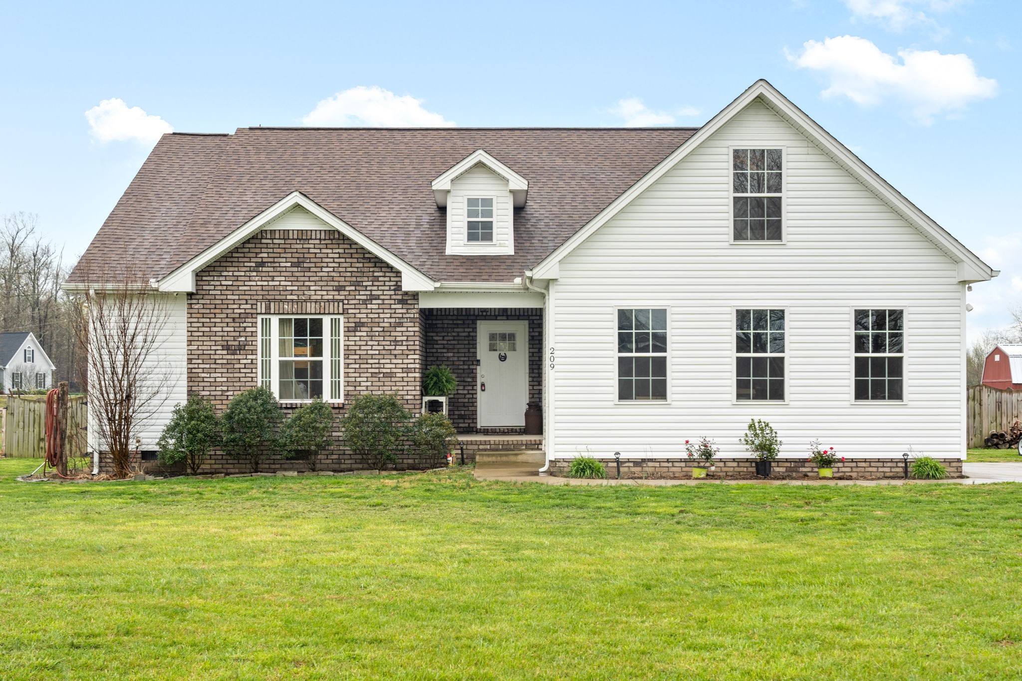 209 Northup Road Portland, TN 37148 - Photo 1 of 39 a front view of house with yard and green space