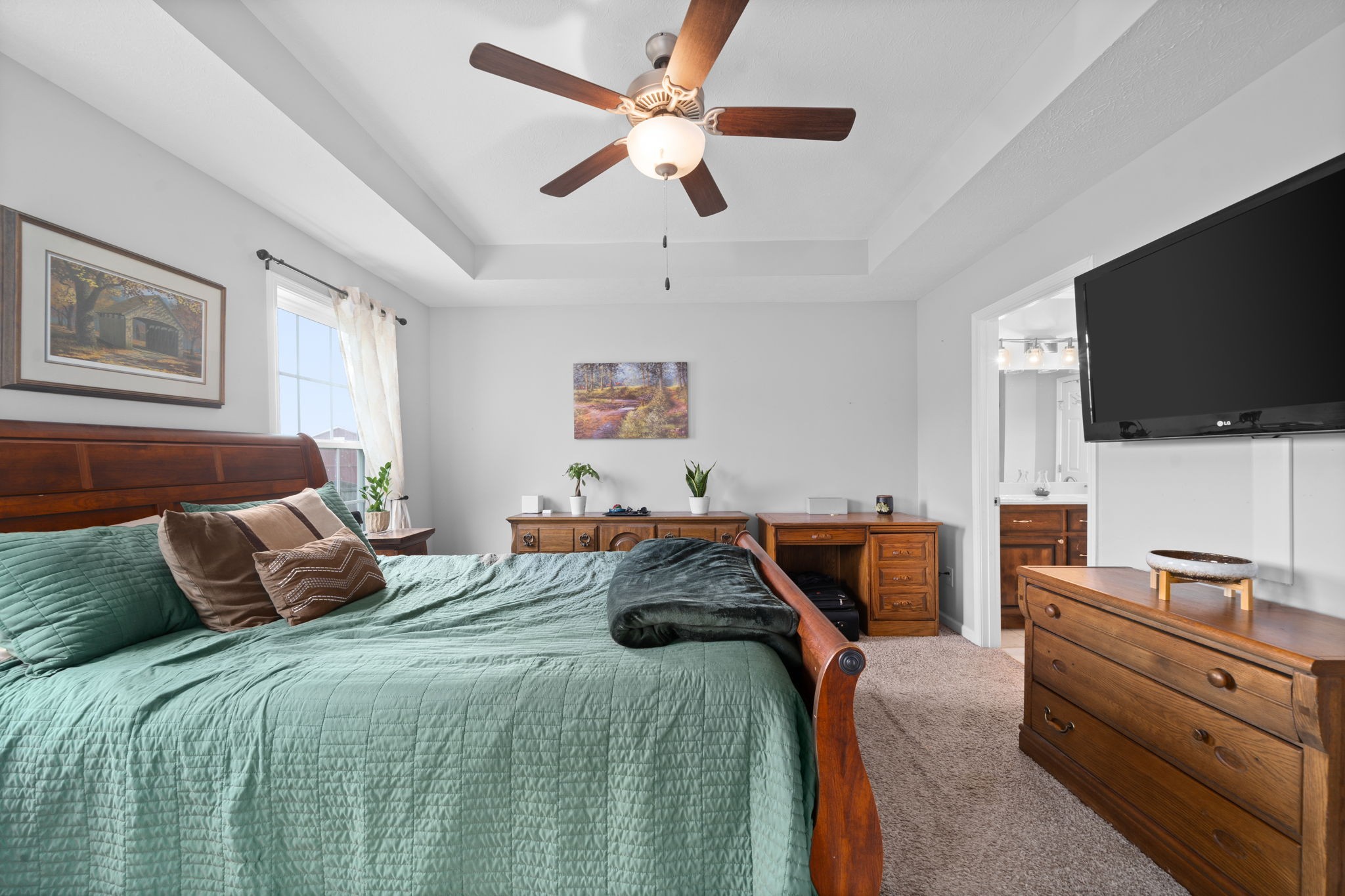 209 Northup Road Portland, TN 37148 - Photo 14 of 39 a bedroom with a bed and a flat screen tv