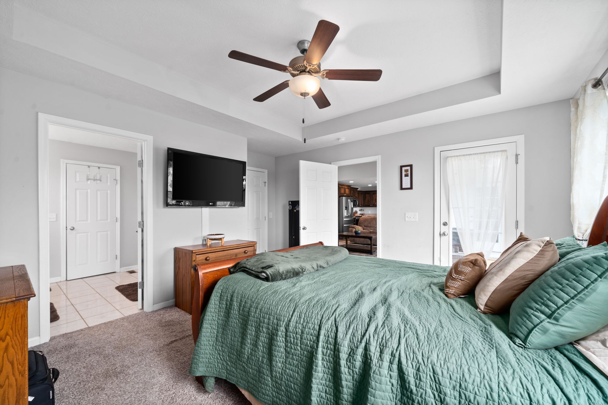 209 Northup Road Portland, TN 37148 - Photo 15 of 39 a bedroom with a bed and a flat screen tv